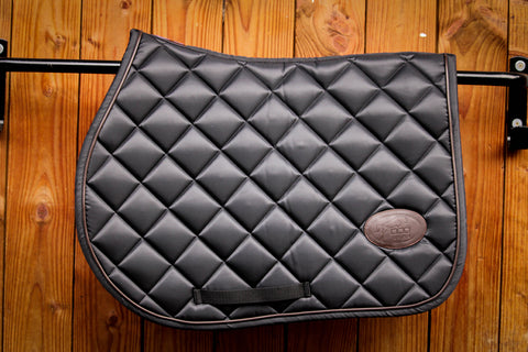 Jump'in tapis de selle pour sauter